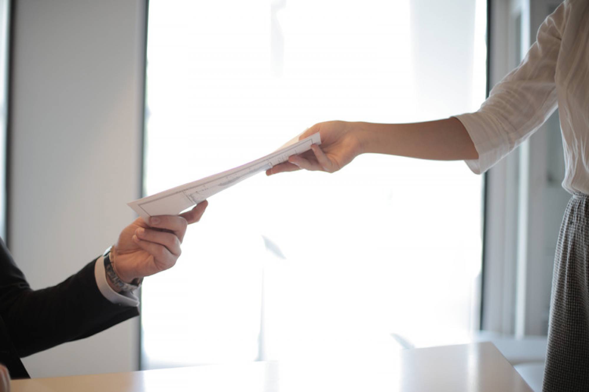 Canva - Job Applicant Passing Her Documents