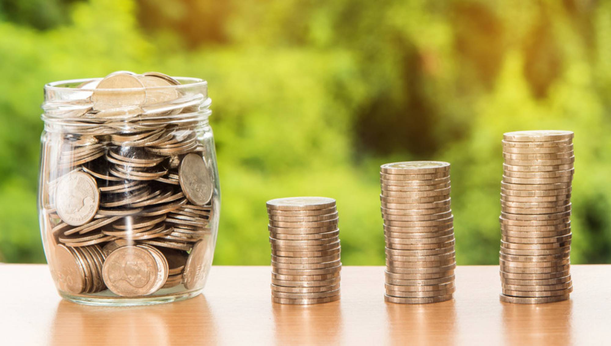 Canva - Piled Coins and Coins in a Jar